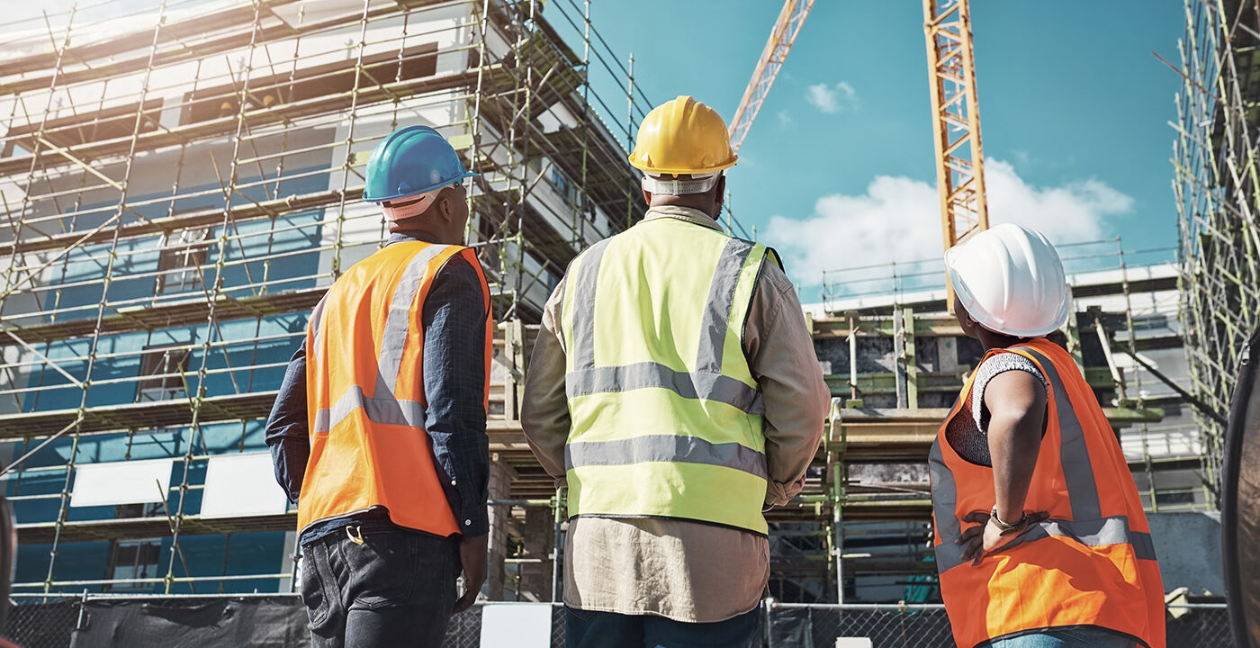 Construction workers looking a work site